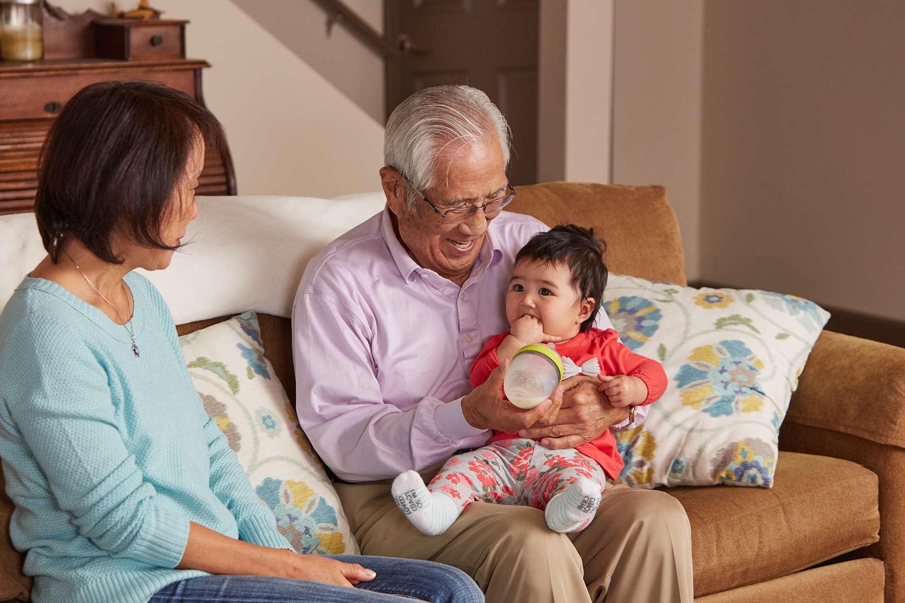 grandpa feeding baby